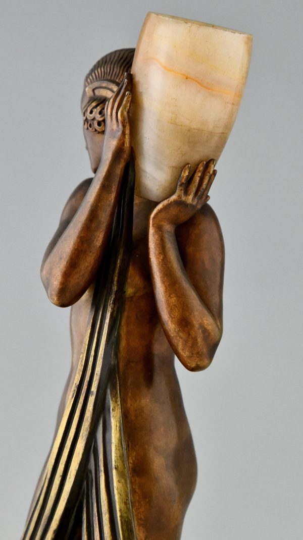 Art Deco bronze lamp sculpture draped nude holding a vase