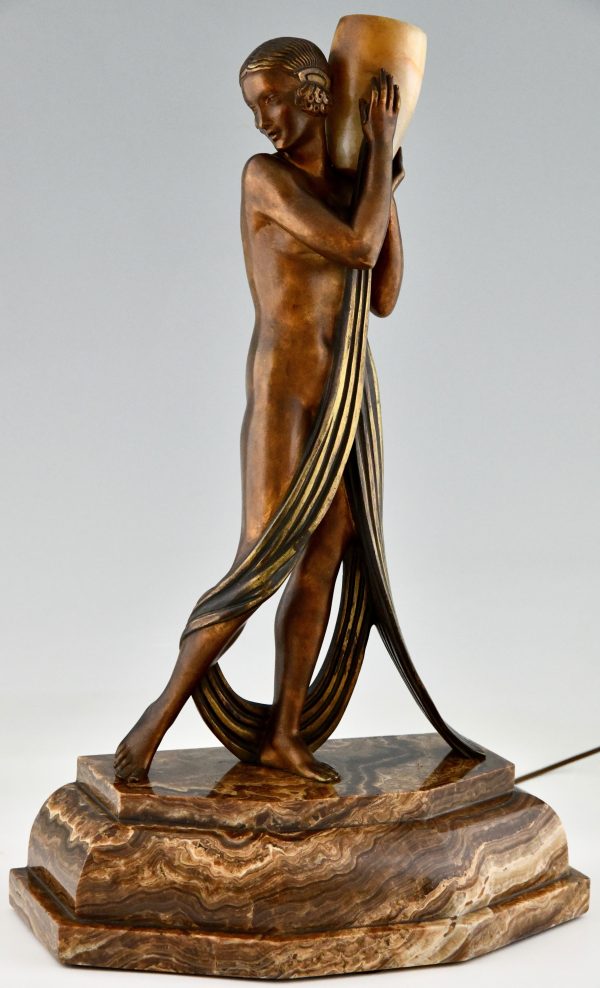 Art Deco bronze lamp sculpture draped nude holding a vase