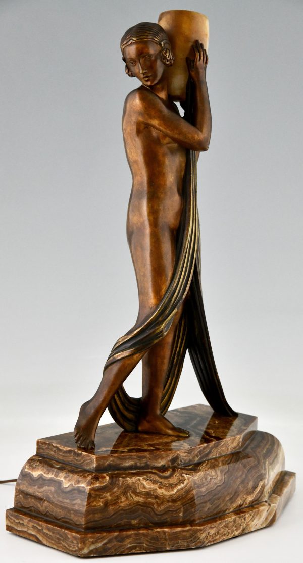 Art Deco bronze lamp sculpture draped nude holding a vase