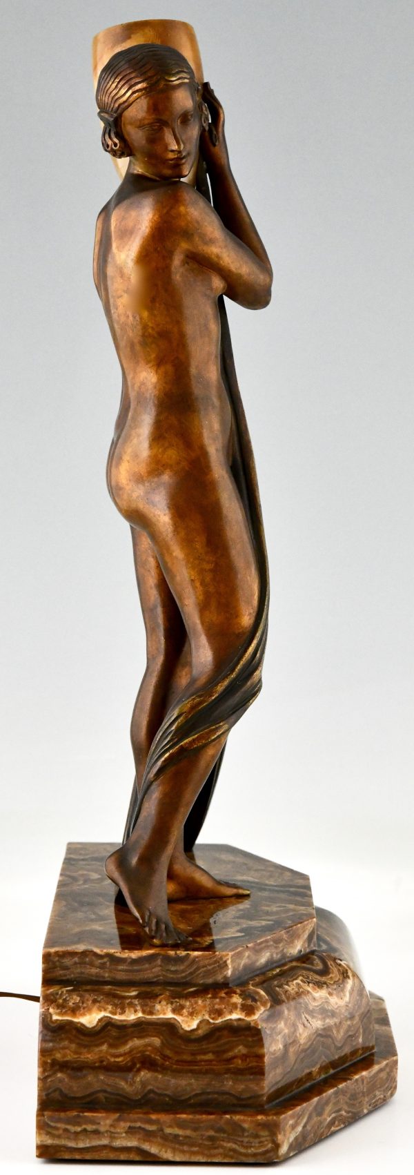 Art Deco bronze lamp sculpture draped nude holding a vase