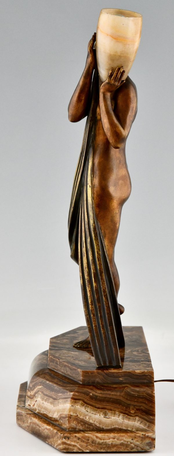 Art Deco bronze lamp sculpture draped nude holding a vase