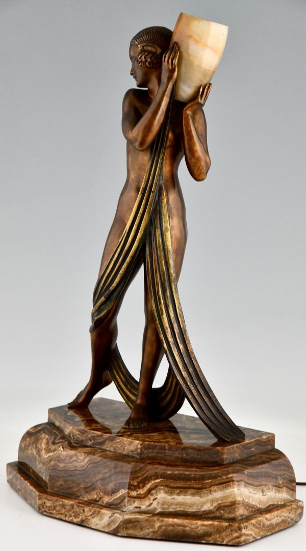 Art Deco bronze lamp sculpture draped nude holding a vase