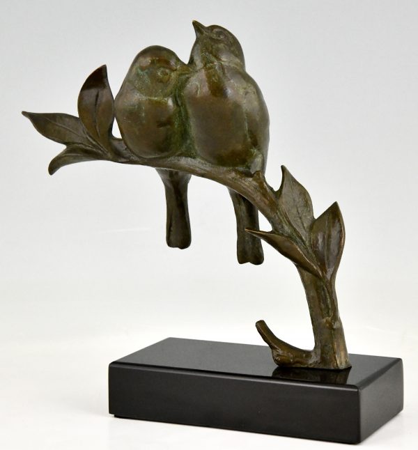 Art Deco sculptuur twee vogels op een tak.