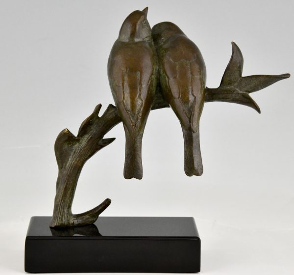 Art Deco sculptuur twee vogels op een tak.