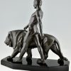 Art Deco sculpture of a male nude walking with lion Belluaire