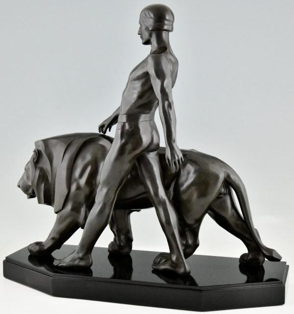 Art Deco sculpture of a male nude walking with lion Belluaire