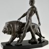 Art Deco sculpture of a male nude walking with lion Belluaire