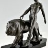 Art Deco sculpture of a male nude walking with lion Belluaire