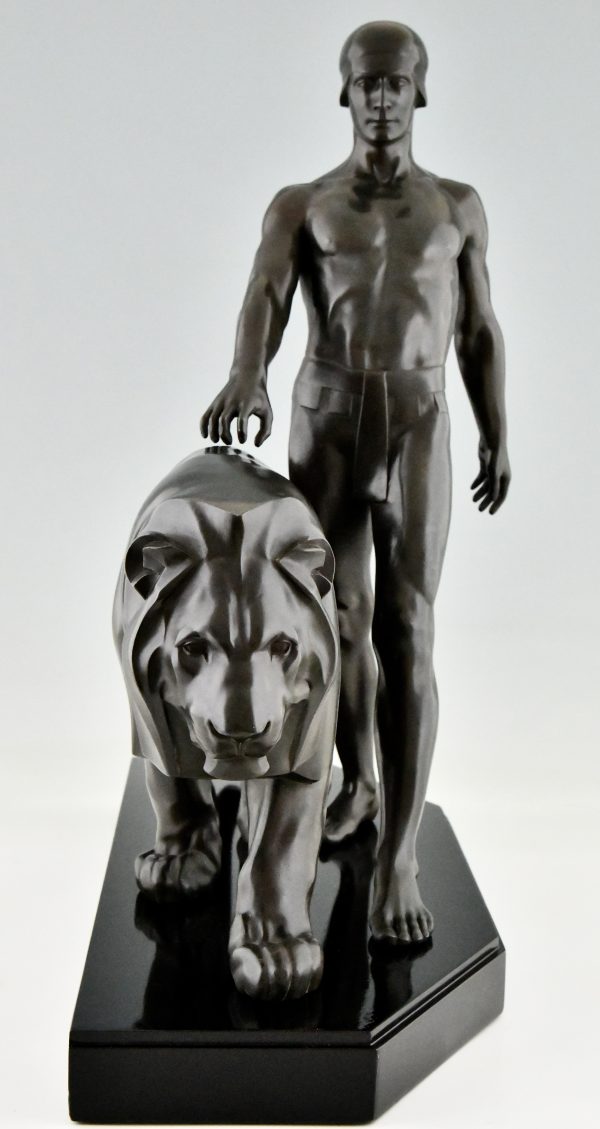 Art Deco sculpture of a male nude walking with lion Belluaire