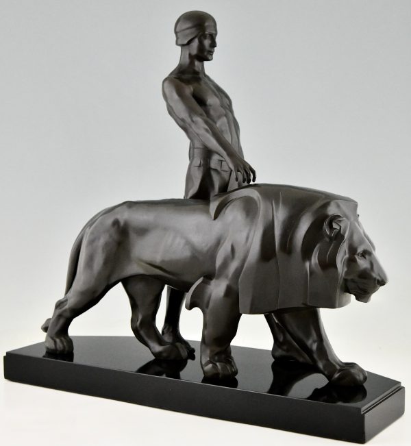 Art Deco sculpture of a male nude walking with lion Belluaire