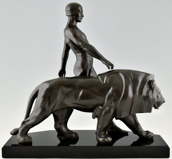 Art Deco sculpture of a male nude walking with lion Belluaire