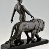 Art Deco sculpture of a male nude walking with lion Belluaire