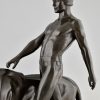 Art Deco sculpture of a male nude walking with lion Belluaire