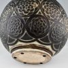 Art Deco spherical ceramic vase with stylized motifs.