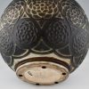 Art Deco spherical ceramic vase with stylized motifs.
