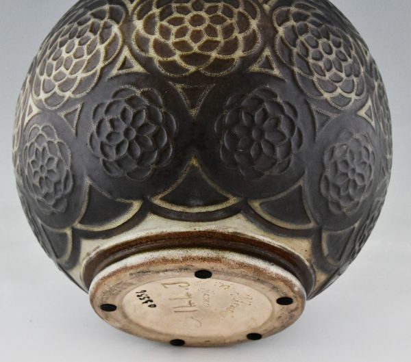 Art Deco spherical ceramic vase with stylized motifs.