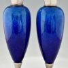 Art Deco blue ceramic and bronze vases or urns.