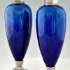 Art Deco blue ceramic and bronze vases or urns.
