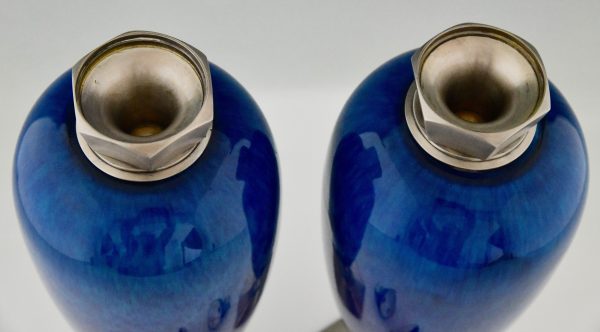 Art Deco blue ceramic and bronze vases or urns.