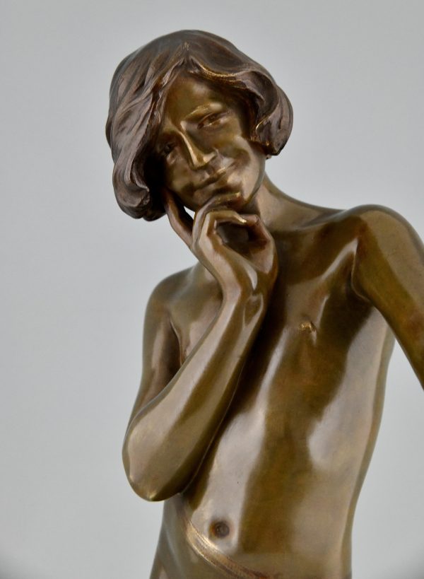 Art Nouveau bronze sculpture teenage boy with apple.