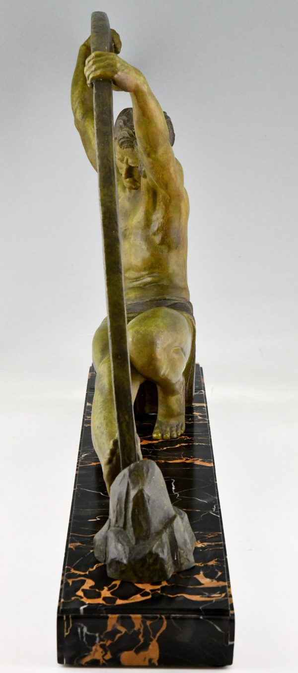 Art Deco sculpture athletic man bending a bar L’age du bronze