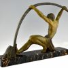 Art Deco sculpture athletic man bending a bar L’age du bronze