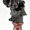 Antique bronze bust of a smiling child.