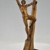 Art Deco bronze sculpture athletic man on a rock