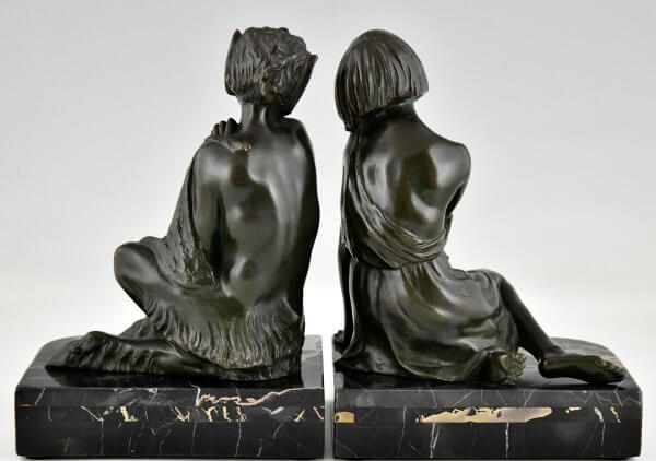 Art Deco bronzen boekensteunen sater faun en nimf