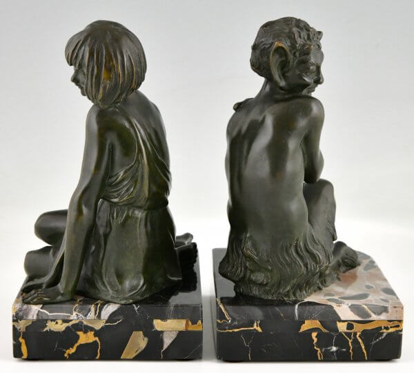 Art Deco bronzen boekensteunen sater faun en nimf