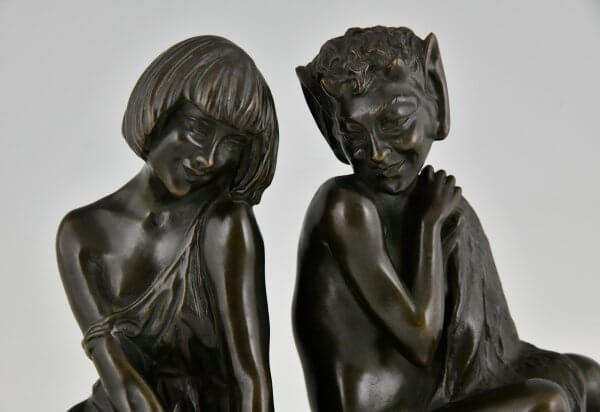 Art Deco bronzen boekensteunen sater faun en nimf