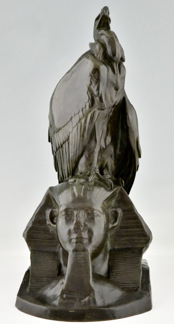 Antique bronze sculpture of a vulture on a sphinx