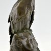 Antique bronze sculpture of a vulture on a sphinx