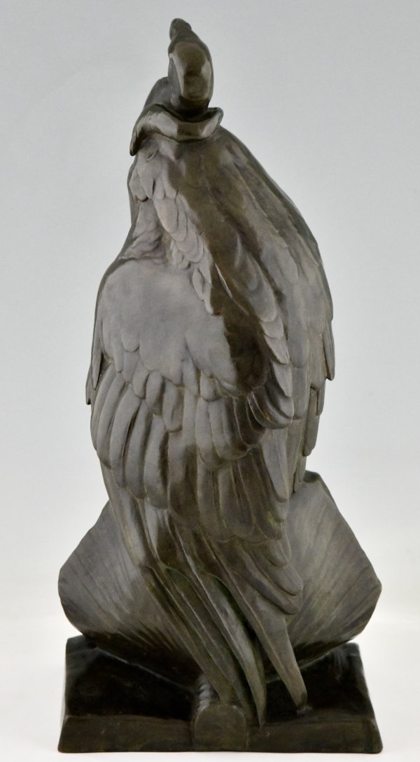 Antique bronze sculpture of a vulture on a sphinx