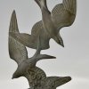 Art Deco sculpture birds in flight.