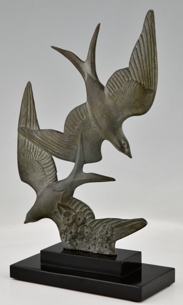 Art Deco sculpture birds in flight.