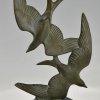 Art Deco sculpture birds in flight.