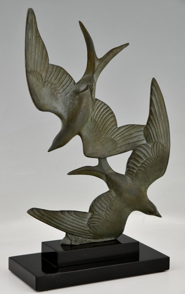 Art Deco sculpture birds in flight.