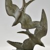 Art Deco sculpture birds in flight.