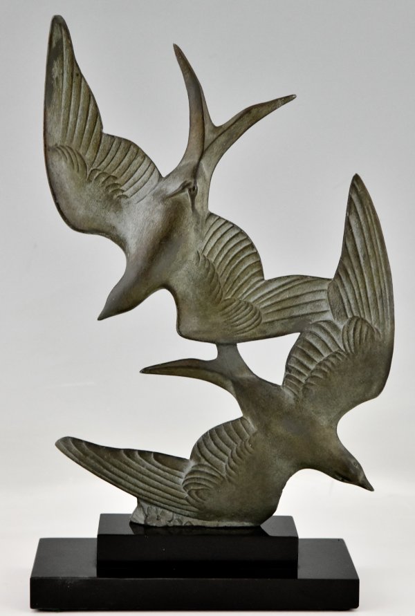 Art Deco sculpture birds in flight.