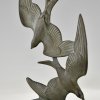 Art Deco sculpture birds in flight.