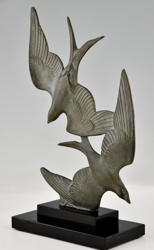 Art Deco sculpture birds in flight.