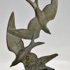 Art Deco sculpture birds in flight.