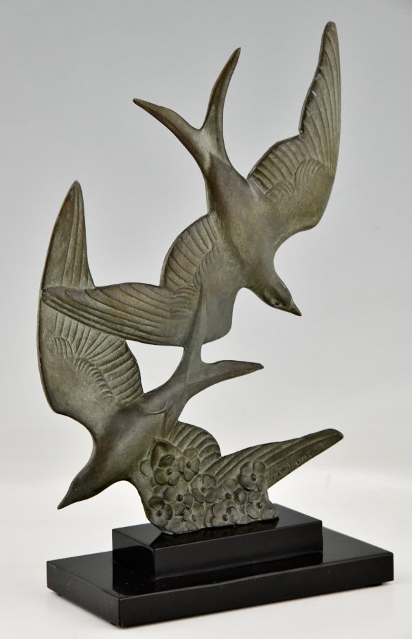 Art Deco sculpture birds in flight.