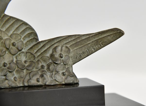 Art Deco sculpture birds in flight.