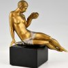 Art Deco bronze sculpture seated nude with flowers.