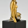 Art Deco bronze sculpture seated nude with flowers.