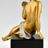 Art Deco bronze sculpture seated nude with flowers.