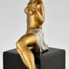 Art Deco bronze sculpture seated nude with flowers.