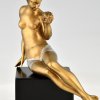 Art Deco bronze sculpture seated nude with flowers.